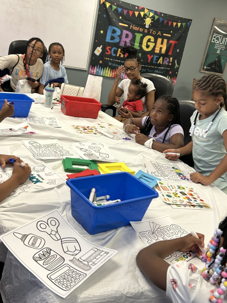 families enjoy aquatic themed back-to-school art and storytime at the library