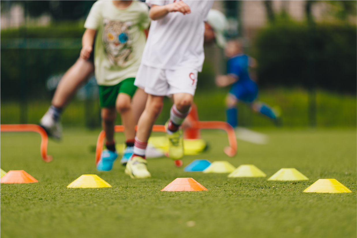 children running through an obstacle course