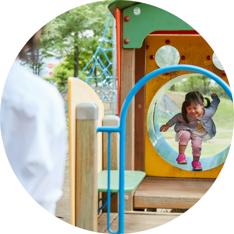 child walking through tunnel on playground