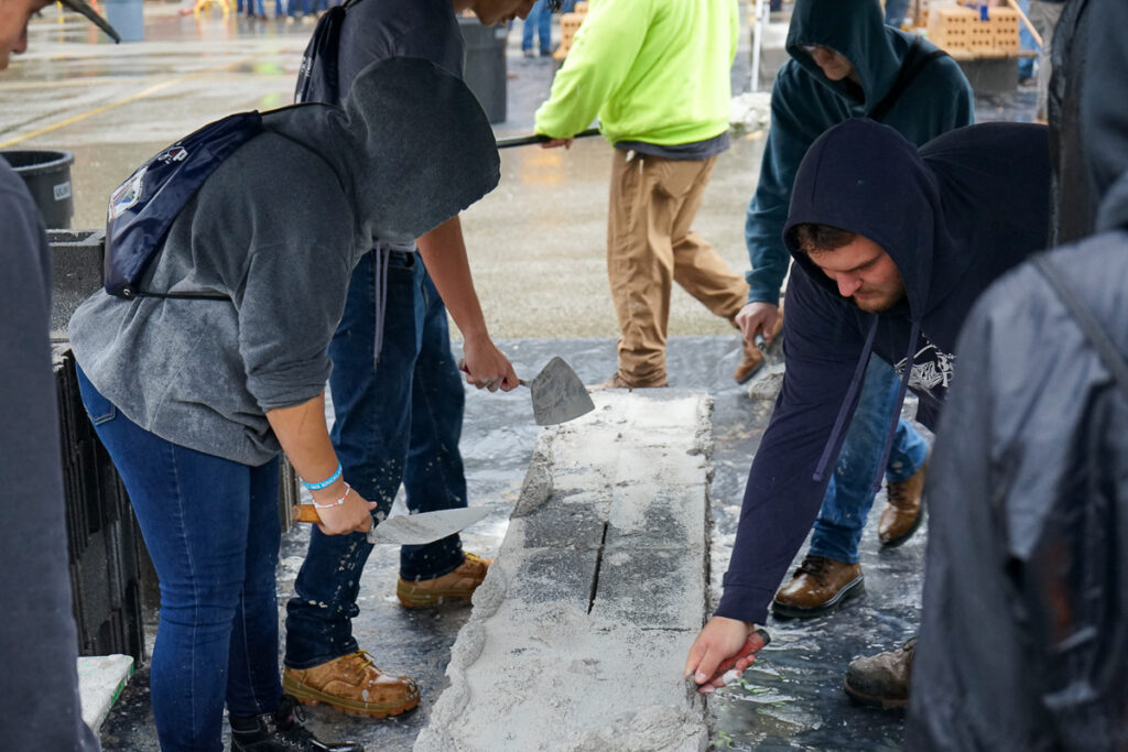 students participate in bricklayer competition and explore career pathways