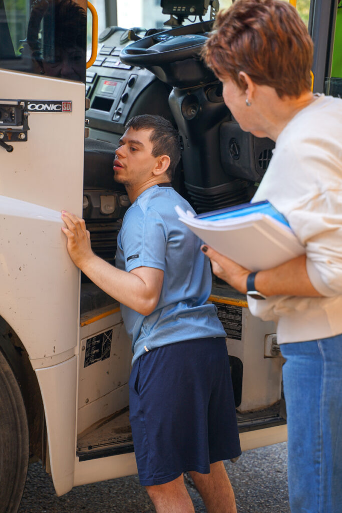 student outside garbage truck