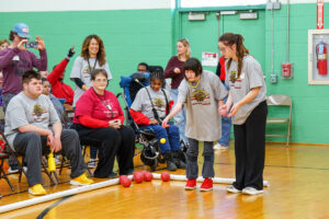 student plays bocce ball