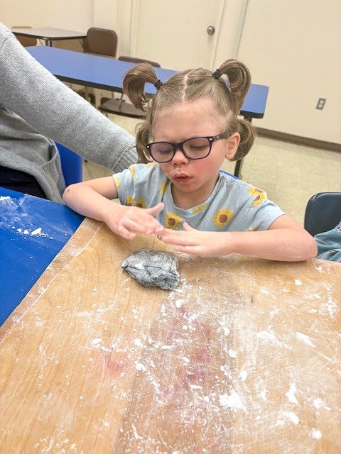 students building gingerbread house
