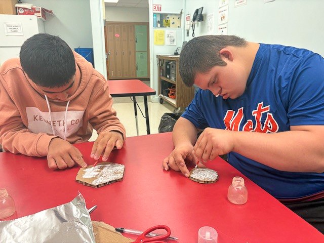 students building gingerbread house