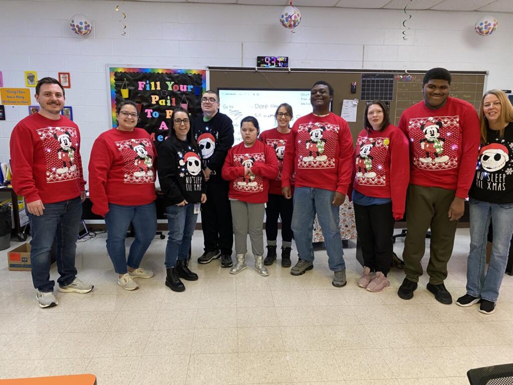 students in matching christmas sweaters