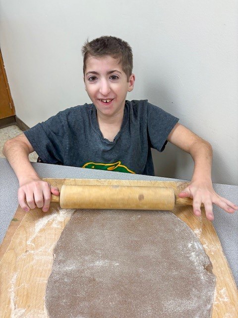 students building gingerbread house
