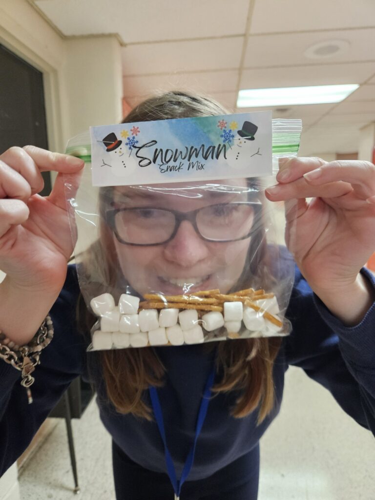 student with snowman snack mix