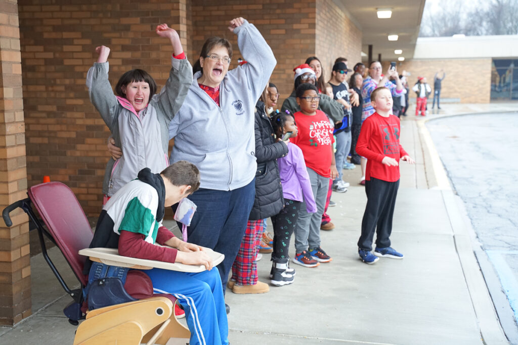 students greet police officers at school