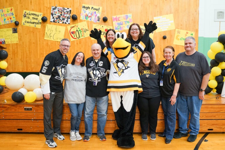 pittsburgh penguins mascot with principal David Campos and Sunrise School staff
