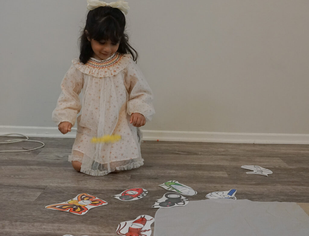 A head start student playing a counting activity