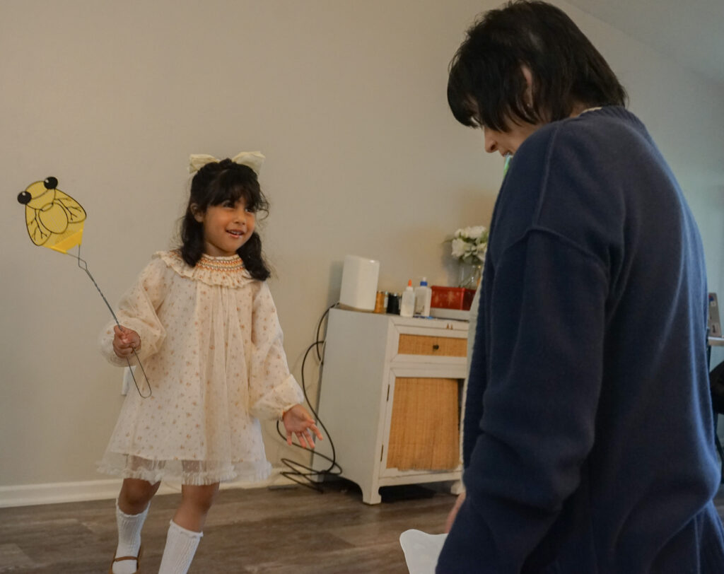 Michele Stillwagon and a head start student play a counting activity