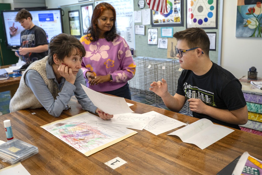 art teachers work with student