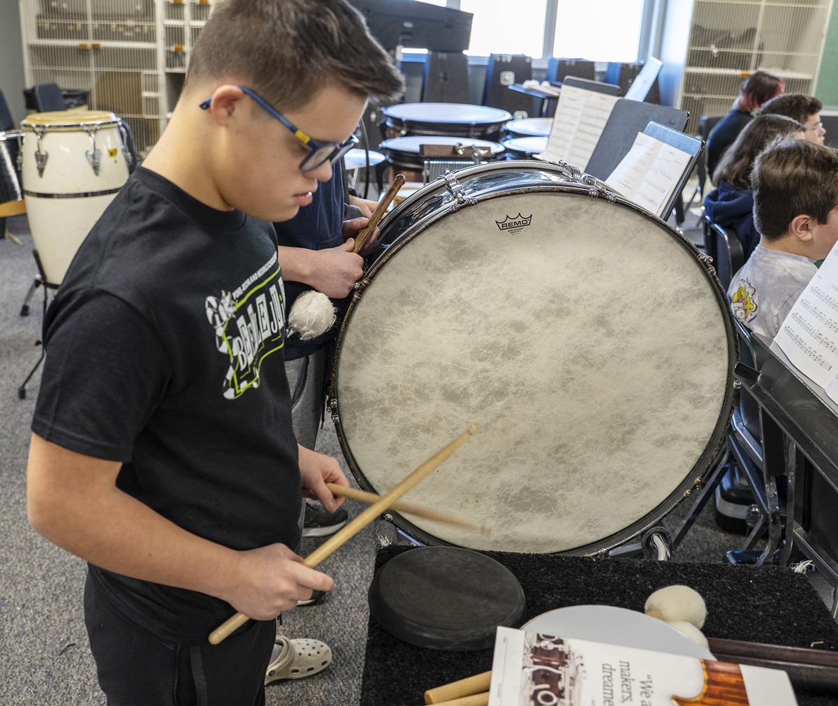 student play drums in band practice