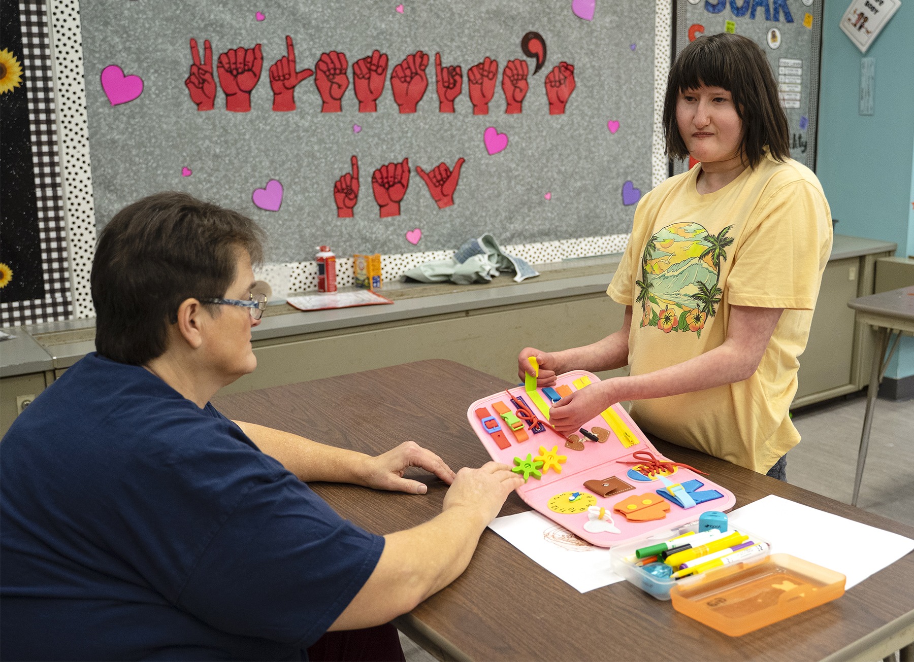 student and interpreter inside classroom