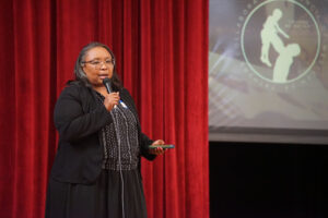 Angela Gressem of Healthy Start speaks at the conference