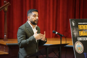 Mandeep Gill, deputy director of the department of human services, speaks to attendees