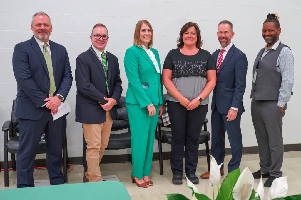 teacher is recognized by administration for her completion of the BridgeUp Teach program