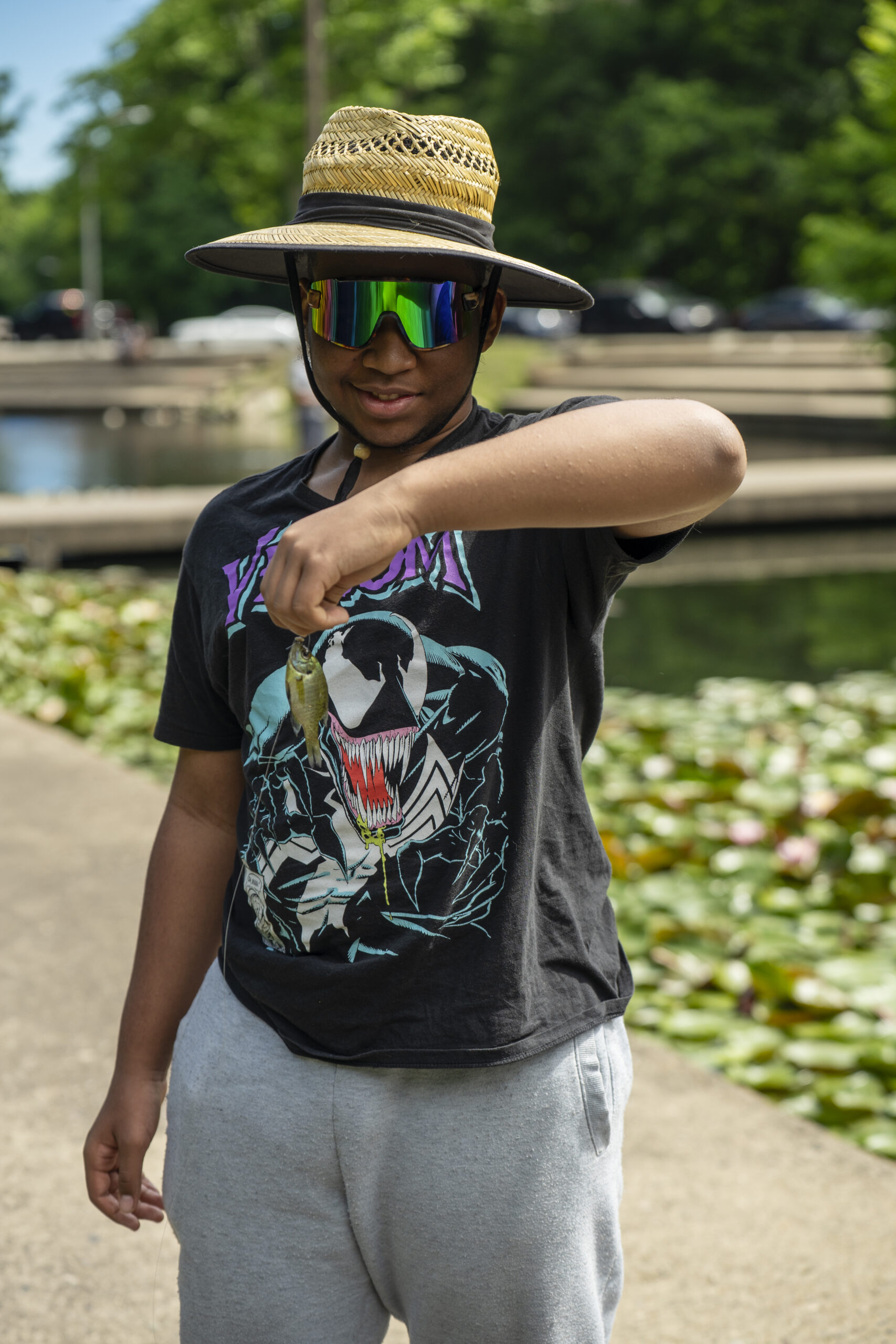 Son posing with caught fish