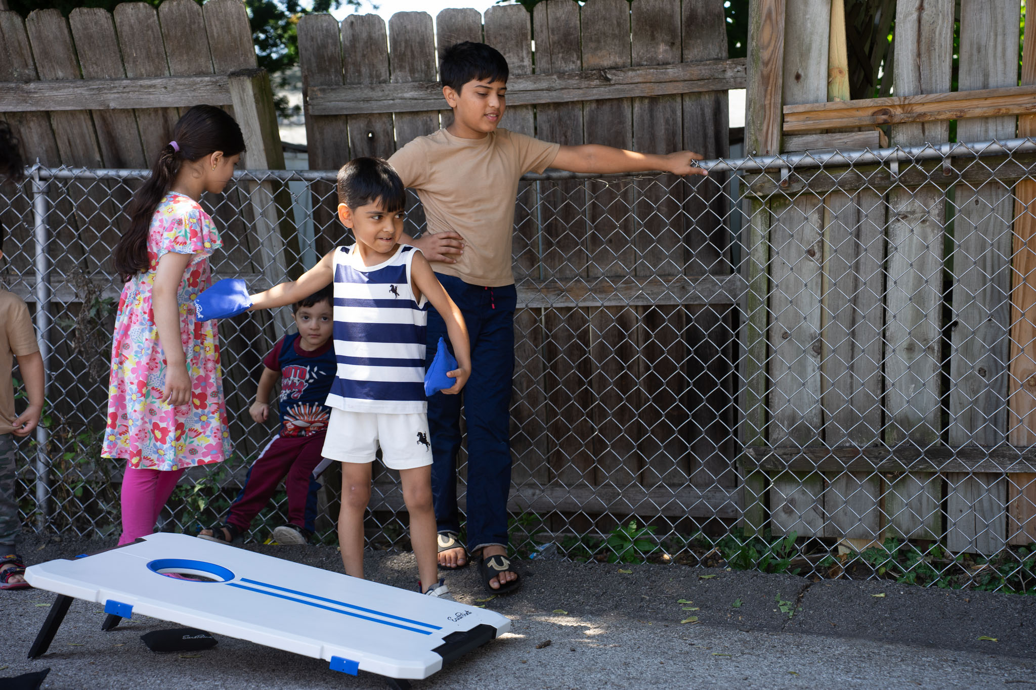 kids playing cornhole
