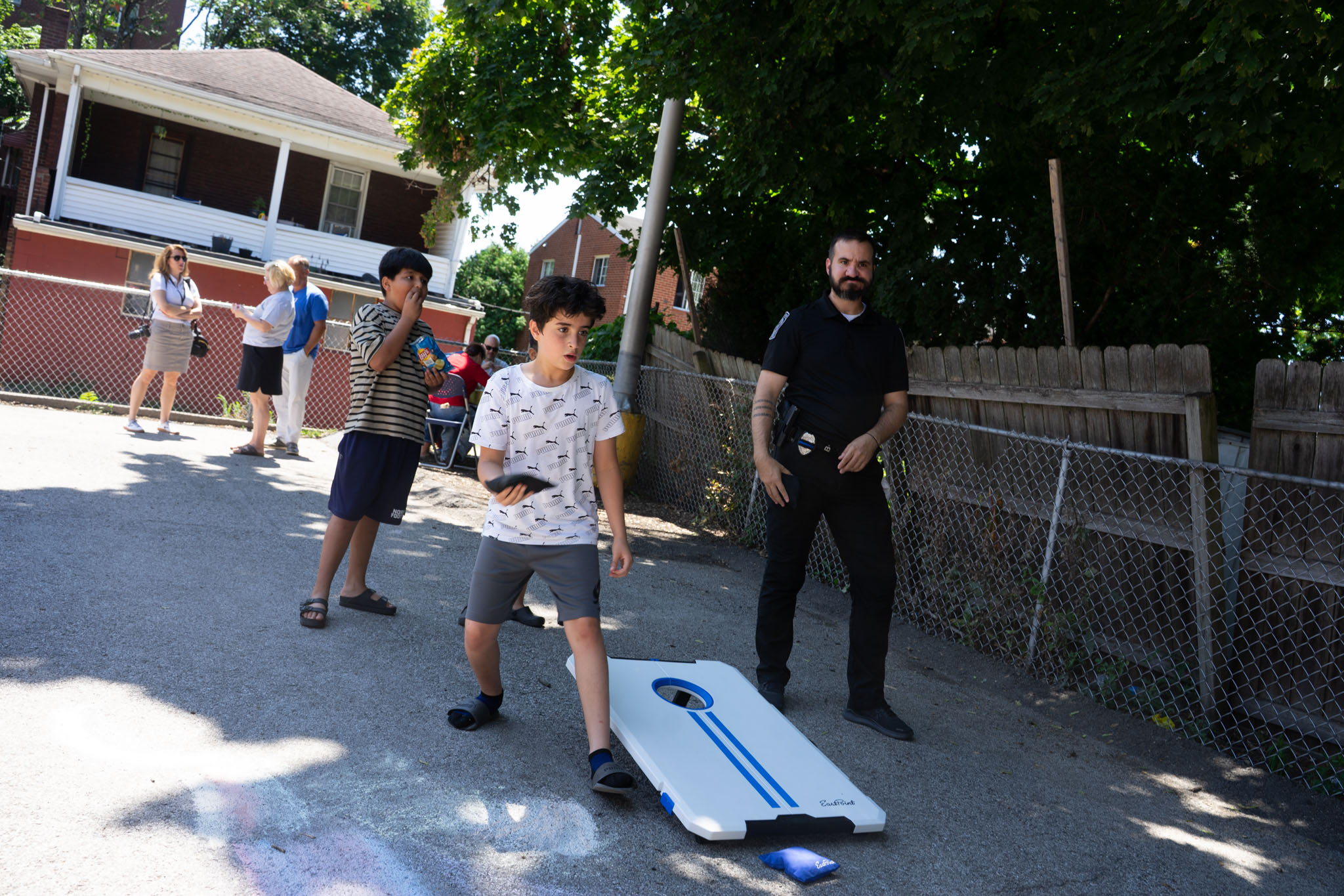 kids playing cornhole