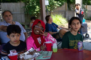 kids enjoying food off the grill