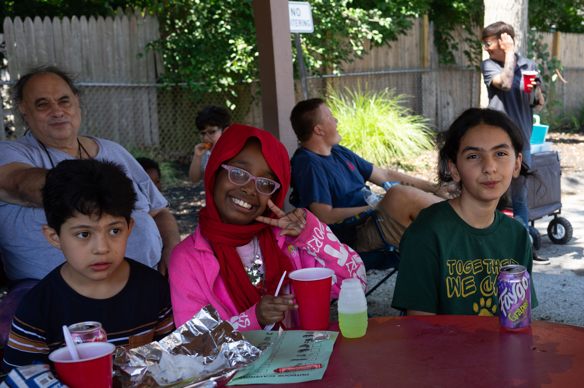 kids enjoying food off the grill