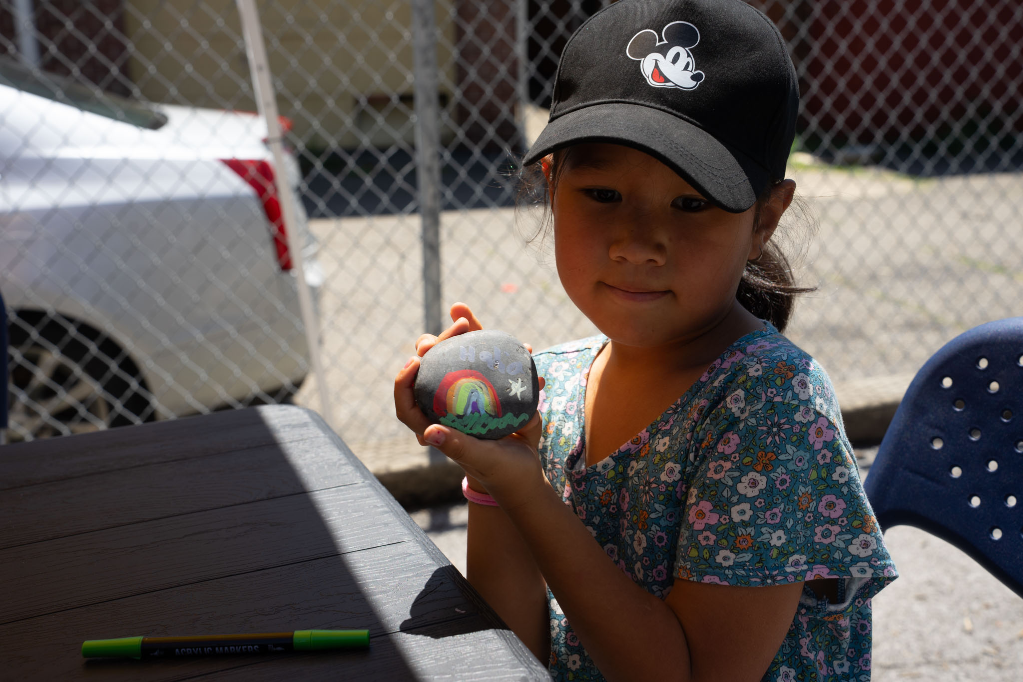 girl sharing her rock art
