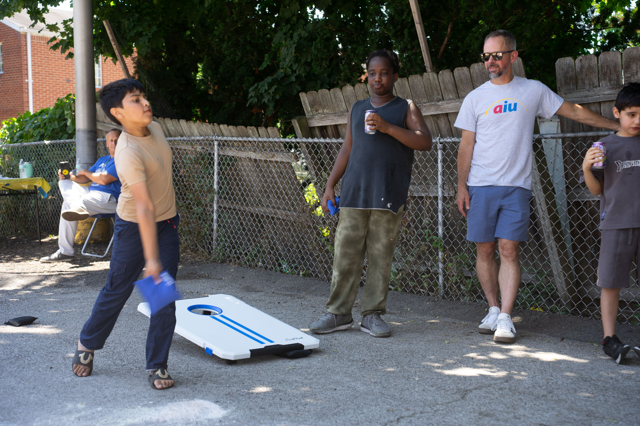 kids playing cornhole