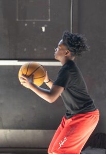Boy shooting 3-pointers for talent show