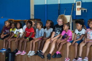 Summer camp kids singing a group song