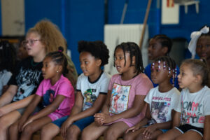 Summer camp kids singing a group song