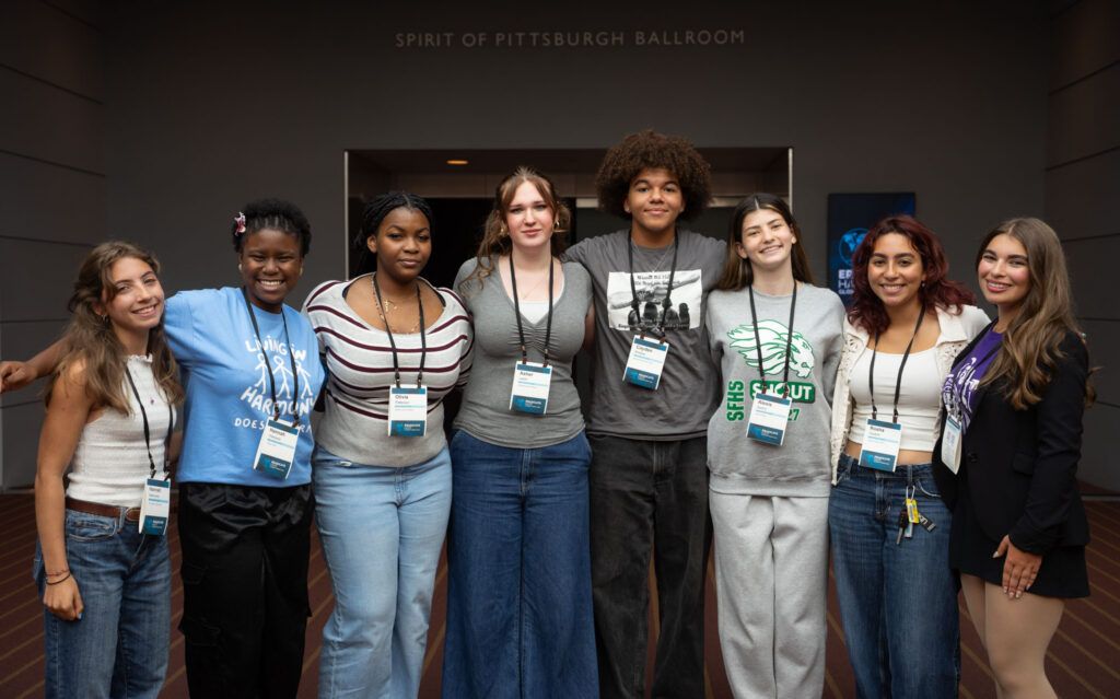 group photo of student panelists in front of the ballroom entrance