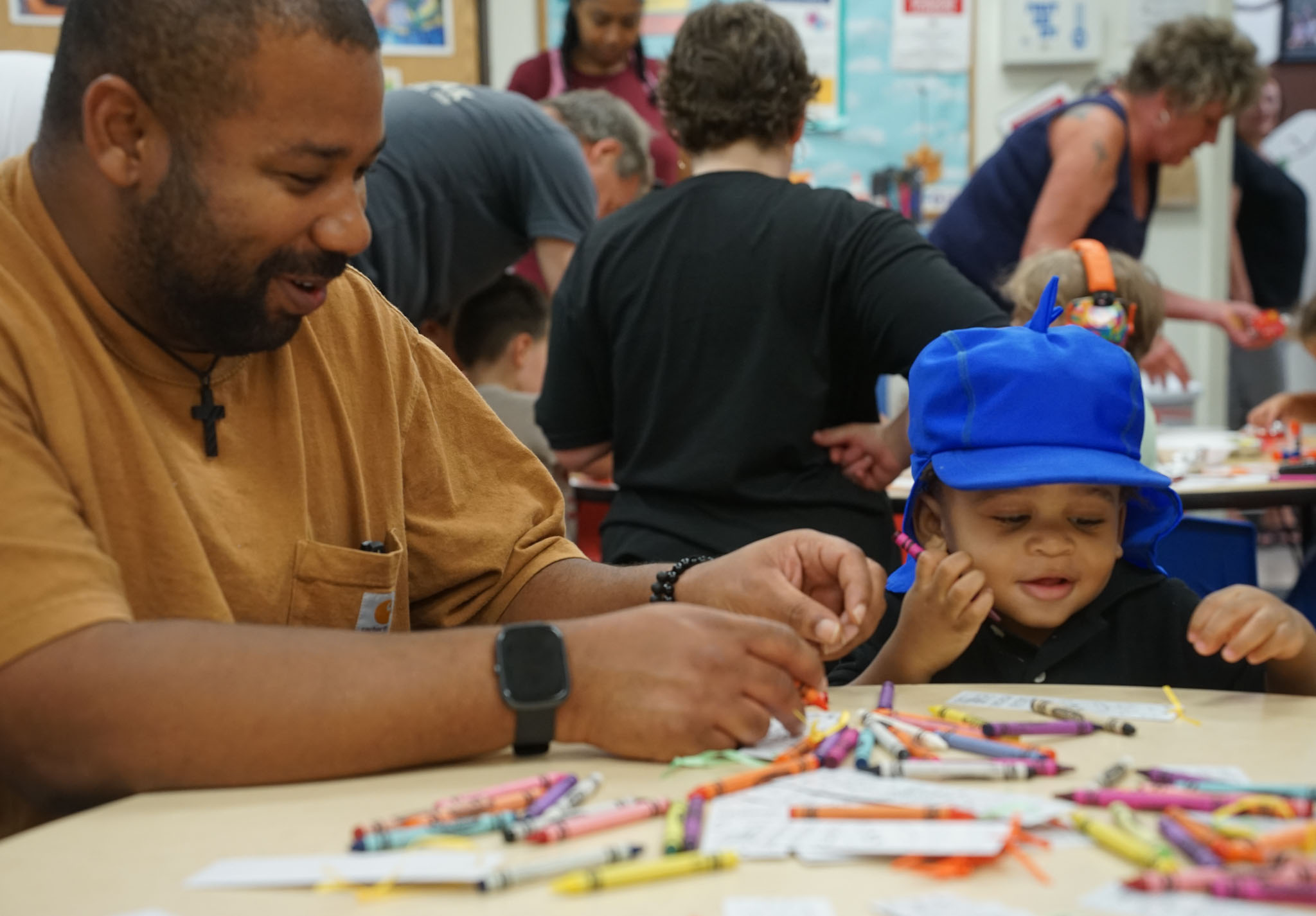 Father and son coloring together