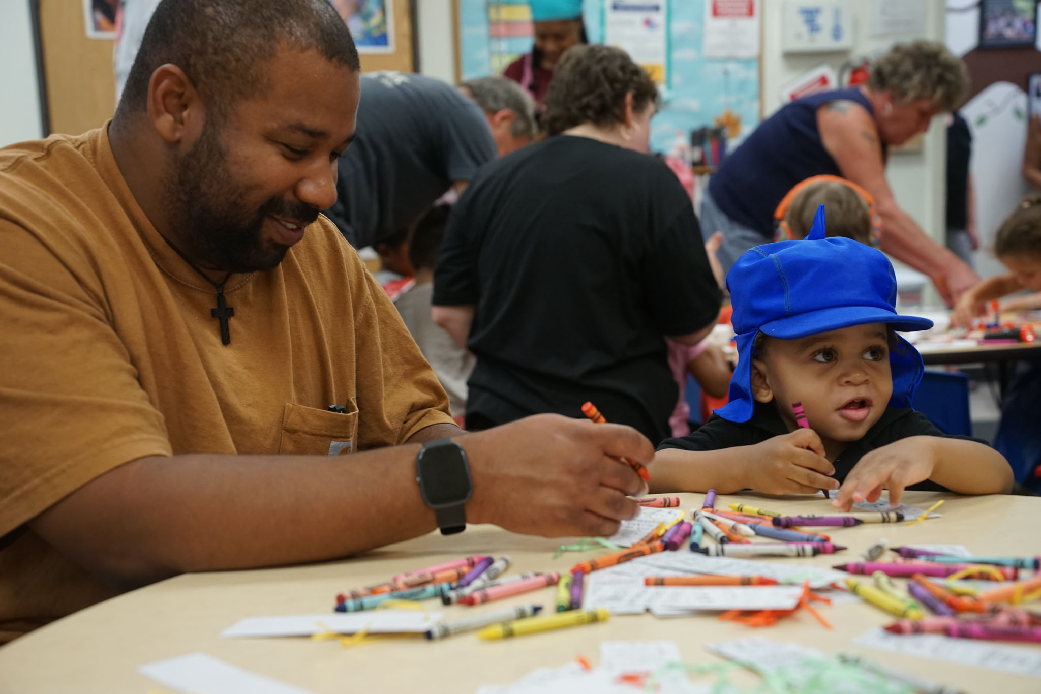 Father and son coloring together