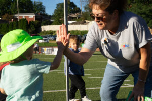 Ms. Robin giving kids a high five