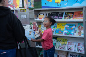 Young students explore the scholastic book sale