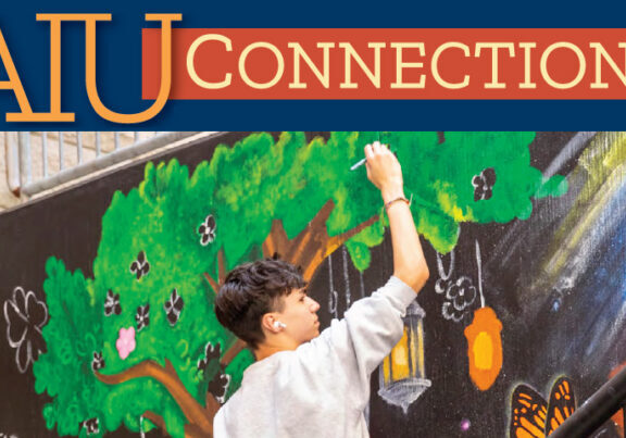 cover image shows students painting a nature mural
