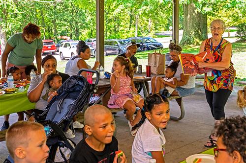 Story time during a family center picnic lunch